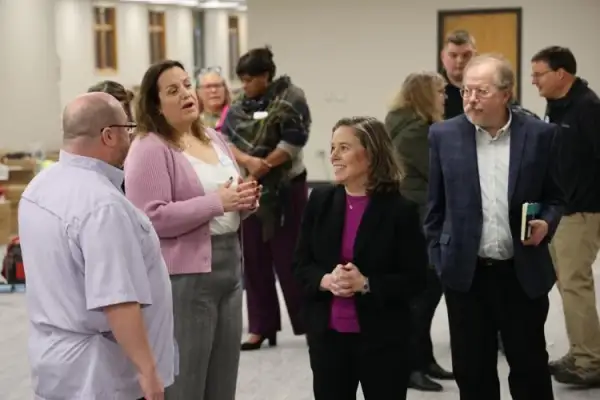 Lt. Gov. Rodriguez talks with community leaders during visit to Day Resource Center Photo